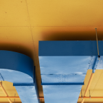 Thermal bridge condensation on commercial HVAC ductwork leading to mold growth.