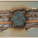 A section of a historic lath and plaster wall showing water damage, illustrating moisture issues common in Bellaire homes and requiring specialized care.