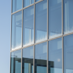 Evidence of cold-bridge condensation and moisture within a commercial building's plenum space, a common issue addressed by The Uptown Protocol.