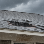 Severe interior water damage with visible staining and sagging on a drywall ceiling, indicating a 'created opening' in the roof. This scene exemplifies the critical evidence discussed in our 'Restoration Experts Guide to Roof Claims' for homeowners facing denied claims.