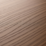 Close-up of luxury Sterling Millwork hardwood showing 'checking' (hairline cracks) caused by rapid drying after water damage.