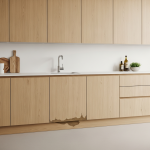Close-up of custom wooden kitchen cabinets showing severe water damage, including warped panels and discoloration near the base, visually illustrating why the 'Line of Sight Rule' is crucial for comprehensive damage assessment and replacement.