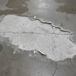 Concrete scaling flood damage industrial floor