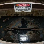 Elevator pit water damage oil contamination