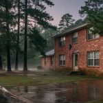 Brick home among pine trees after rain